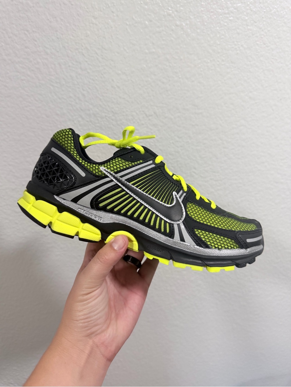 Nike black and volt Vomero 5